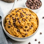Chickpea Cookie Dough Recipe: Healthy, No-Bake, and Delicious 5 Overhead view of chickpea cookie dough with chocolate chips in a silver bowl