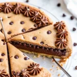 Chocolate Chip Cookie Cake – The Best Giant Cookie You’ll Ever Bake 5 Sliced chocolate chip cookie cake showing gooey chocolate center and frosting swirls