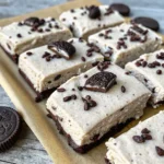 Cookies and Cream Protein Bar Recipe | Easy, Delicious, High-Protein Snack 5 Cookies and cream protein bar topped with crushed chocolate cookies
