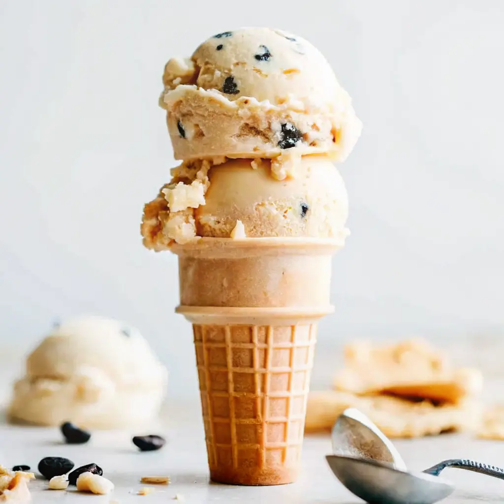 Chocolate Chip Cookie Dough Ice Cream: Safe, Fun, and Delicious 3 Ice cream cone stacked with scoops of chocolate chip cookie dough ice cream