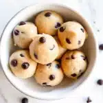 Cookie Dough Bites: Easy No-Bake Treat You Can Make at Home 5 Homemade edible cookie dough balls with chocolate chips in a bowl