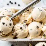 Creamy chocolate chip cookie dough ice cream scooped into a dish