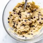 Is Eat Party Vegan Cookie Dough Chocolate Chip Keto? Everything You Need to Know 5 Creamy vegan chocolate chip cookie dough in a glass bowl with a spoon