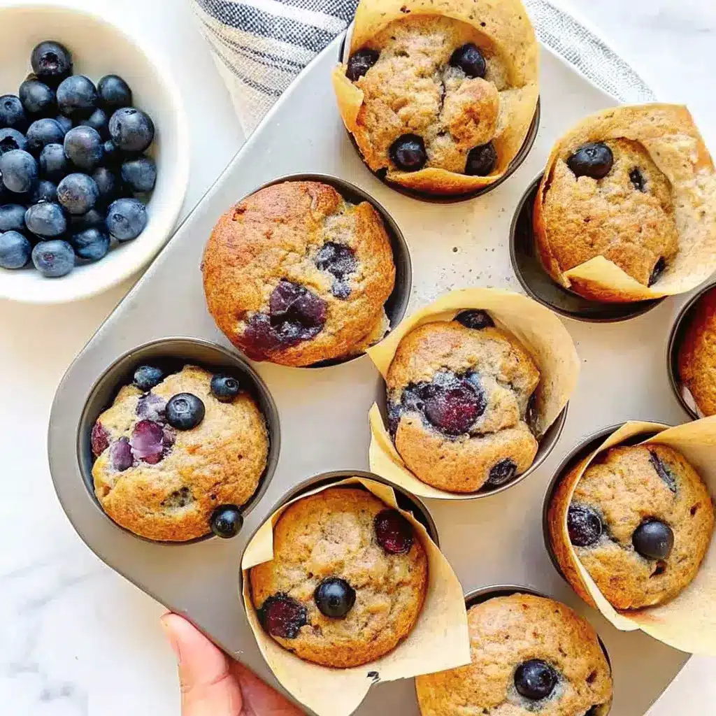 Cottage Cheese Blueberry Muffins: High-Protein, Easy, and Delicious 1 Freshly baked cottage cheese blueberry muffins in a muffin tin