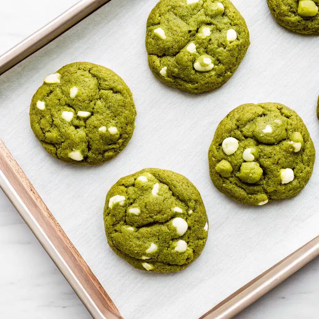 Matcha White Chocolate Cookies: Soft, Chewy & Easy to Make 1 Six matcha green tea white chocolate cookies arranged neatly on a baking sheet