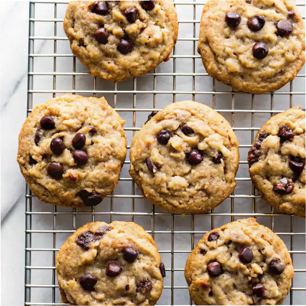 Peanut Butter Oatmeal Chocolate Chip Cookies – Easy, Chewy & Classic 1 Freshly baked peanut butter oatmeal chocolate chip cookies on cooling rack
